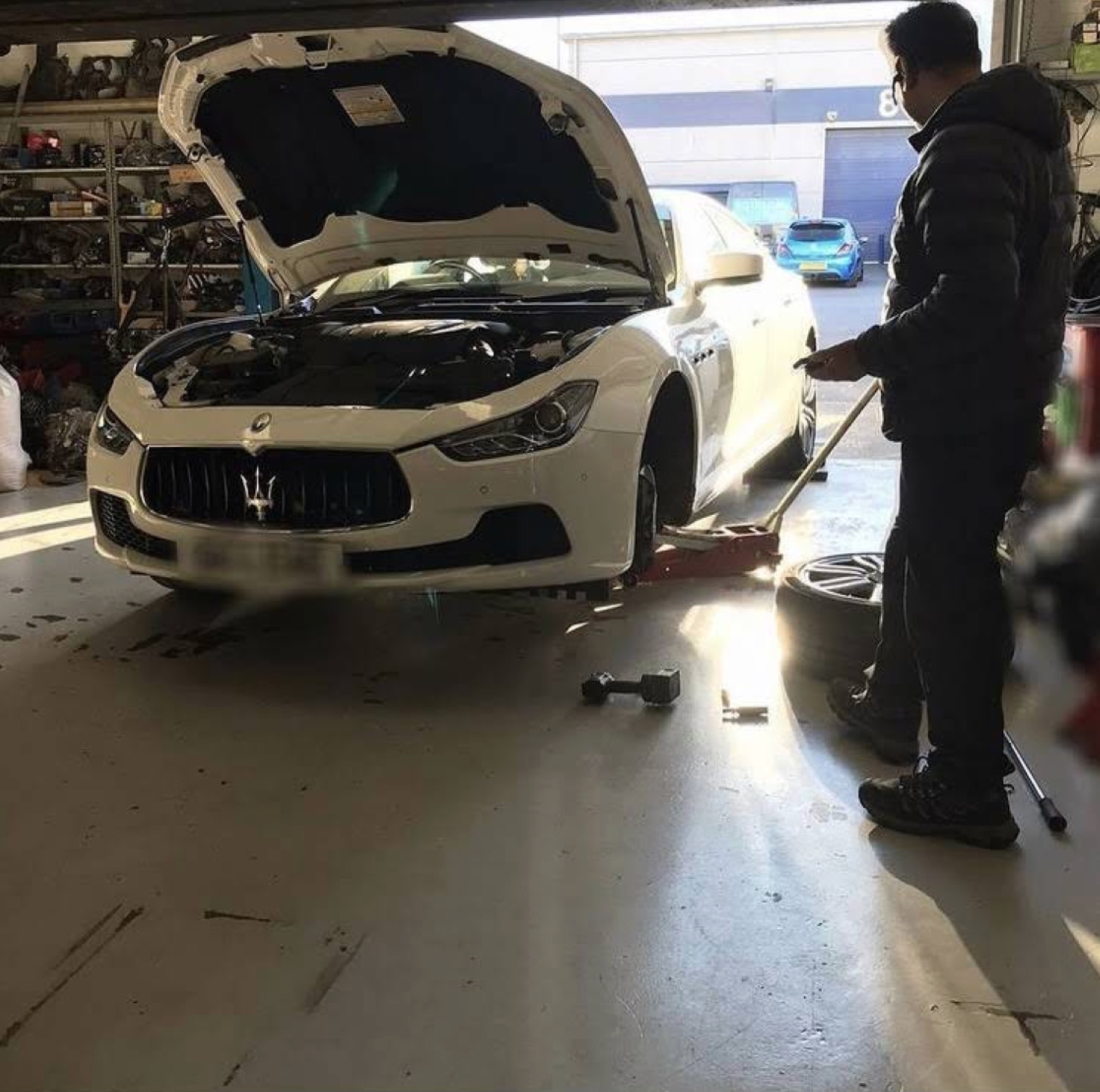 Maj working on a Maserati at the workshop